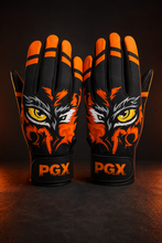 PGX Eye of the Tiger baseball batting gloves in premium studio lighting showing orange tiger artwork and wrist closures